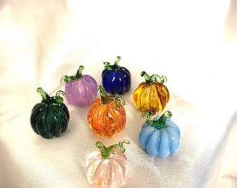 tiny glass pumpkin.