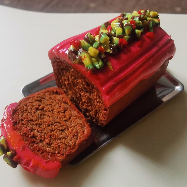 Miniature 1:6 Scale Raspberry and Pistachio Loaf Cake with 2 slices. Suitable for fashion dolls and dioramas. Handmade with Clay