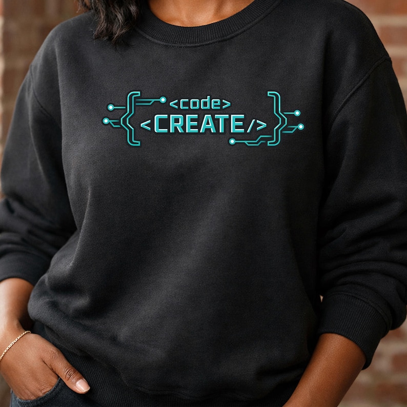 May include: Black sweatshirt with the text "<code/> CREATE</>" in a teal circuit board design. The sweatshirt is a crew neck style and has long sleeves. The text is centered on the chest.