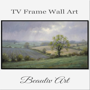 Op de afbeelding: Een ingelijst landschapsschilderij met een zwarte rand. Het kunstwerk toont een landelijke scène met glooiende groene heuvels, velden en een grote boom met groene bladeren. De lucht is bewolkt met een vleugje zonlicht. Tekst bovenaan luidt "TV Frame Wall Art" en onderaan "Beauliv Art".