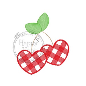May include: Two red heart-shaped cherries with a white and red checkered pattern, with a green stem and leaves.