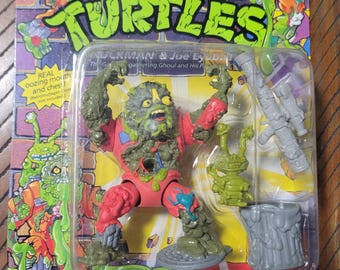 Figura de ação vintage das Tartarugas Ninja, Muckman e Joe Eyeball, de 1990.
