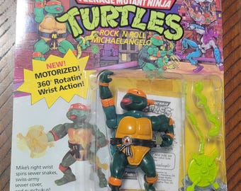Figura de ação vintage das Tartarugas Ninja, do filme "Rock N Roll" de 1989, com Michelangelo e o personagem Whacky Action.