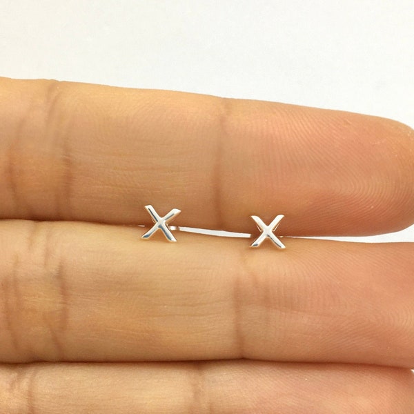 A pair of small X cross sterling silver studs earrings