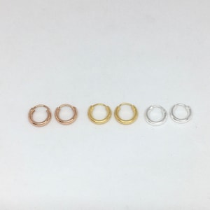 A pair of small 2mm thick 10mm sleepers in sterling silver or gold plated silver small hoops