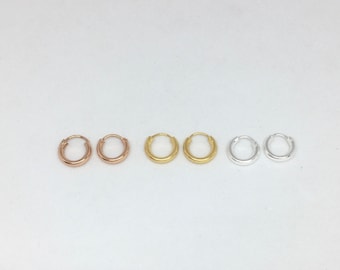 A pair of small 2mm thick 10mm sleepers in sterling silver or gold plated silver small hoops