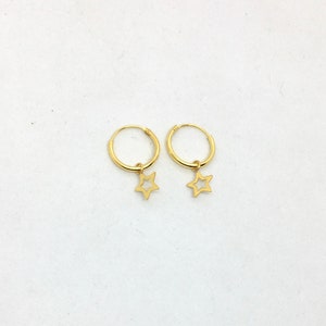A pair of small cutout star charms in yellow gold plated sterling silver hoops, celestial earrings