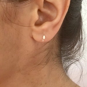 A pair of teardrop hammered wire sleepers in sterling silver, yellow or rose gold small hoops earrings