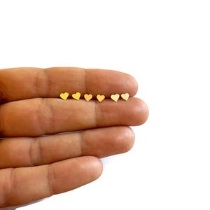 A pair of small heart silver, rose or yellow gold stud earrings, love, friendship jewelry