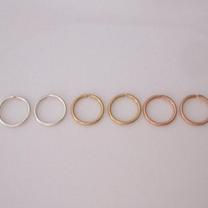 Set of three pairs of sterling silver and 14k gold filled 20 gauge wire small hoops, nose ring, helix hoops