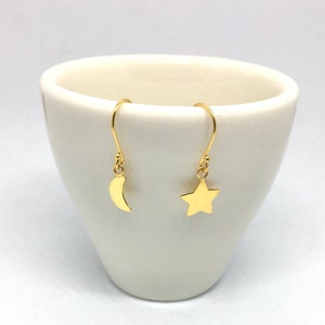 A pair of yellow gold plated sterling silver star and crescent moon dangle earrings, celestial earrings