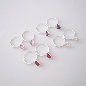 A pair of heart cz charms small hoops in sterling silver