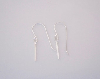 A pair of small bar 925 sterling silver dangle earrings