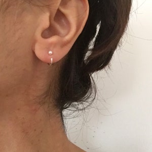 A pair of simulated white pearl sterling silver open hoops
