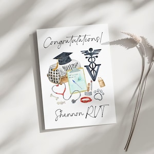 May include: Congratulations card with a watercolor illustration of a graduation cap, a pet carrier, a stethoscope, a clipboard, a bone, a paw print, and a veterinary symbol. The text "Congratulations!" and "Shannon RVT" is written on the card.