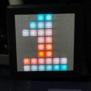 May include: A digital display shows the number "1" formed by illuminated squares in various colors. The display has a black border, with "Exit" and "Edit UI" text at the bottom.