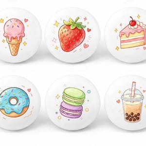May include: Set of six white ceramic knobs featuring colorful illustrations of desserts. Designs include an ice cream cone, strawberry, cake slice, donut, macarons, and a bubble tea drink. Each knob is decorated with hearts and stars.