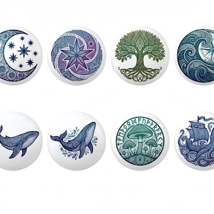 May include: Set of eight white decorative cabinet knobs with various designs. The designs include a crescent moon and stars, a starburst, a tree, waves and a compass, a whale, mushrooms, and a ship with an octopus.
