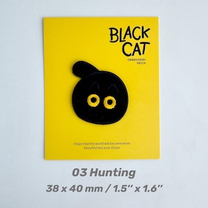 May include: A black cat embroidery patch with yellow eyes, on a yellow card. The card reads "BLACK CAT" and "EMBROIDERY PATCH". The text "I hope that the world will become more beautiful because of you" is also present. The patch measures 1.5" x 1.6".