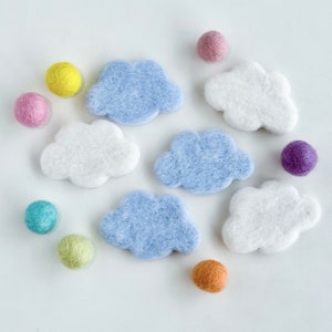 May include: A set of felt clouds in blue and white, with a variety of felt balls in different colors, including pink, yellow, green, purple, and brown.
