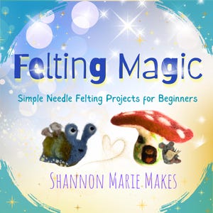 May include: A book cover titled Felting Magic: Simple Needle Felting Projects for Beginners by Shannon Marie Makes. The design features a blue felted snail and a red and white felted mushroom house with a small grey mouse reading a book.