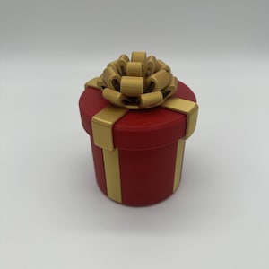 Caja de regalo con tornillos anidados molestos que contiene dinero en efectivo como regalo de Navidad Caja de regalo MUY molesta