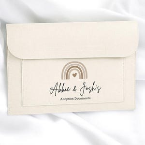 May include: A rustic wooden sign with the text "Welcome to our home" in white lettering. The sign has a distressed finish and a simple, inviting design, ideal for front door decor.