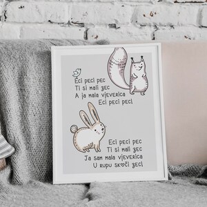 May include: A framed print featuring a whimsical illustration of a bunny and a squirrel. The artwork includes text in a playful font. The color palette is soft, with shades of gray, white, and brown, creating a gentle and inviting aesthetic.