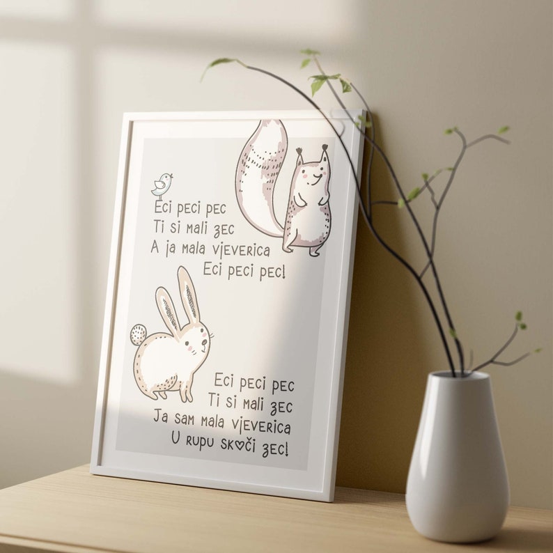 May include: A framed print featuring a whimsical illustration of a squirrel and a rabbit. The artwork is in soft neutral tones and includes text in a playful font. A small bird is also depicted. The print is displayed on a wooden surface.
