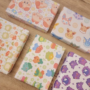 Pu&ograve; includere: Assortimento di dieci fogli di carta da regalo colorati con vari personaggi dei cartoni animati, tra cui Pok&eacute;mon, Kirby e altri design carini.