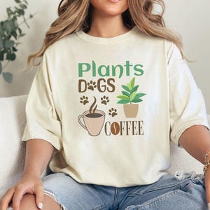 Plants dogs coffee, Gardening shirt, Dog lovers, dog mom shirt, Coffee lover, Plant lovers gift, Plants and dogs, gift for mum, Gardener tee