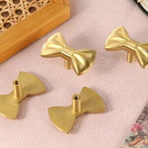 gold bow dresser knobs Knobs, Set of 6 morden Application 2-Pack Gold Bow-Shaped Cabinet Knobs