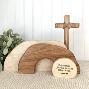 May include: Wooden Easter tomb with a cross and a sign that reads "He is not here. for He is risen, just as He said. Matthew 286"