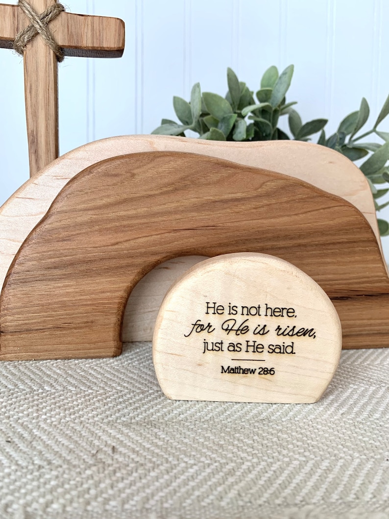 May include: Wooden Easter tomb with a cross and a sign that reads "He is not here, for He is risen, just as He said. Matthew 28:6"