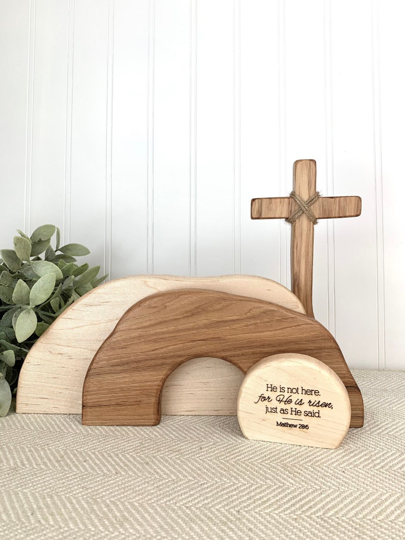 May include: Wooden Easter tomb with a cross and a sign that reads "He is not here. for He is risen, just as He said. Matthew 286"