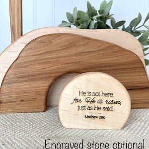 May include: Wooden Easter tomb with a cross and a stone that reads "He is not here. for He is risen, just as He said. Matthew 28:6". The stone is optional and can be engraved.
