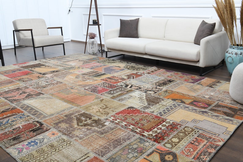 May include: A large, multi-colored patchwork rug with a variety of patterns and textures. The rug is made from recycled materials and has a vintage look.