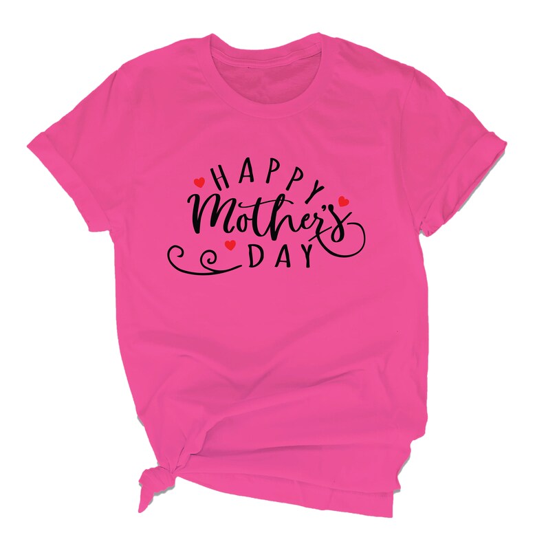 May include: Pink t-shirt with the text "Happy Mother's Day" in black script with red hearts.