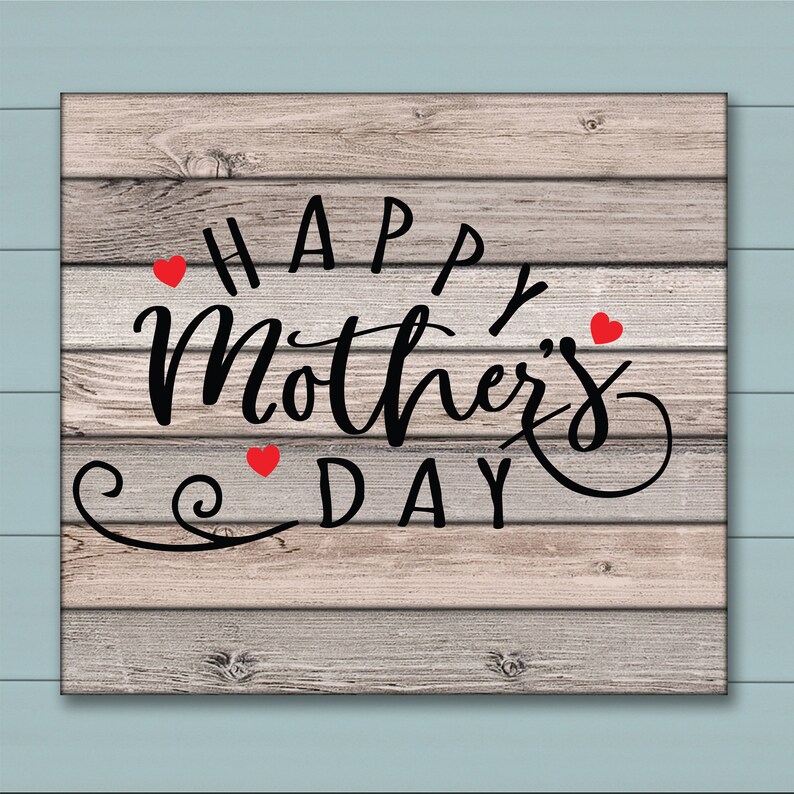 May include: A rustic wooden sign with the text "Happy Mother's Day" in black cursive lettering. Three red hearts are scattered around the text.