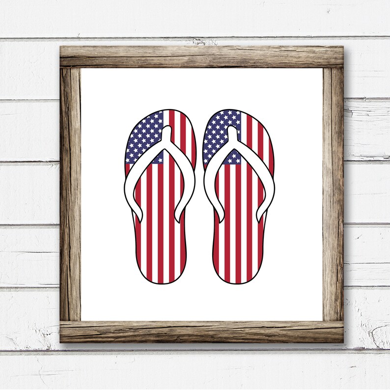May include: A pair of flip flops with the American flag design. The flip flops are white with red and blue stripes.