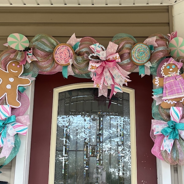 Guirlande lumineuse de Noël en pain d'épice, décoration de Noël rose et vert menthe sur le thème du pays des bonbons