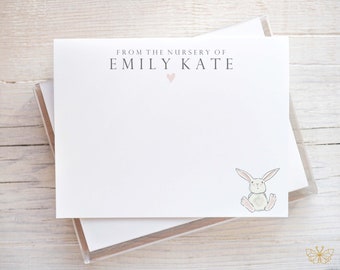 May include: White card stock stationery with the text "From the nursery of Emily Kate" and a pink heart. A white bunny illustration is in the bottom right corner.