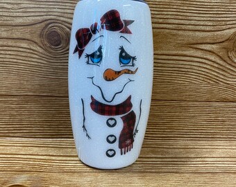 Vaso con purpurina de muñeco de nieve