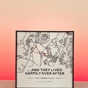 May include: A black and white map of a city with a red heart marking a location. The text below the map reads "... AND THEY LIVED HAPPILY EVER AFTER THE CROWNE PLAZA 41.7151* N/-71.4677" W