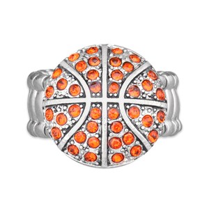 May include: A silver ring with an orange basketball design. The basketball is made of rhinestones.