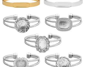 May include: Six different silver and gold bracelets with interchangeable charms. The charms are round, square, oval, and heart shaped. The bracelets are all double-stranded.