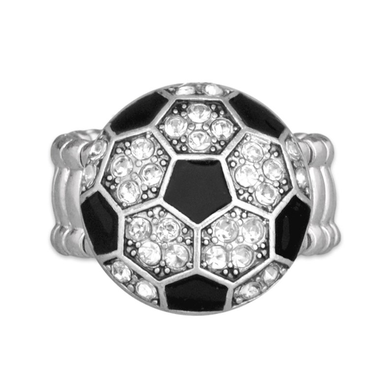May include: A silver ring with a black and white soccer ball design. The soccer ball is encrusted with clear rhinestones.