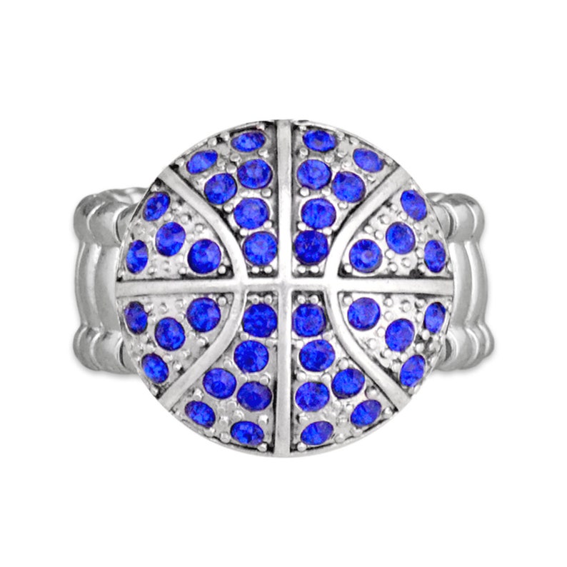 May include: A silver ring with a blue rhinestone basketball design.