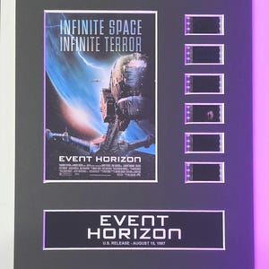 May include: A framed movie poster for the film "Event Horizon" with the tagline "Infinite Space, Infinite Terror". The poster features a spaceship against a backdrop of a blue and black nebula. The frame includes six film strips.