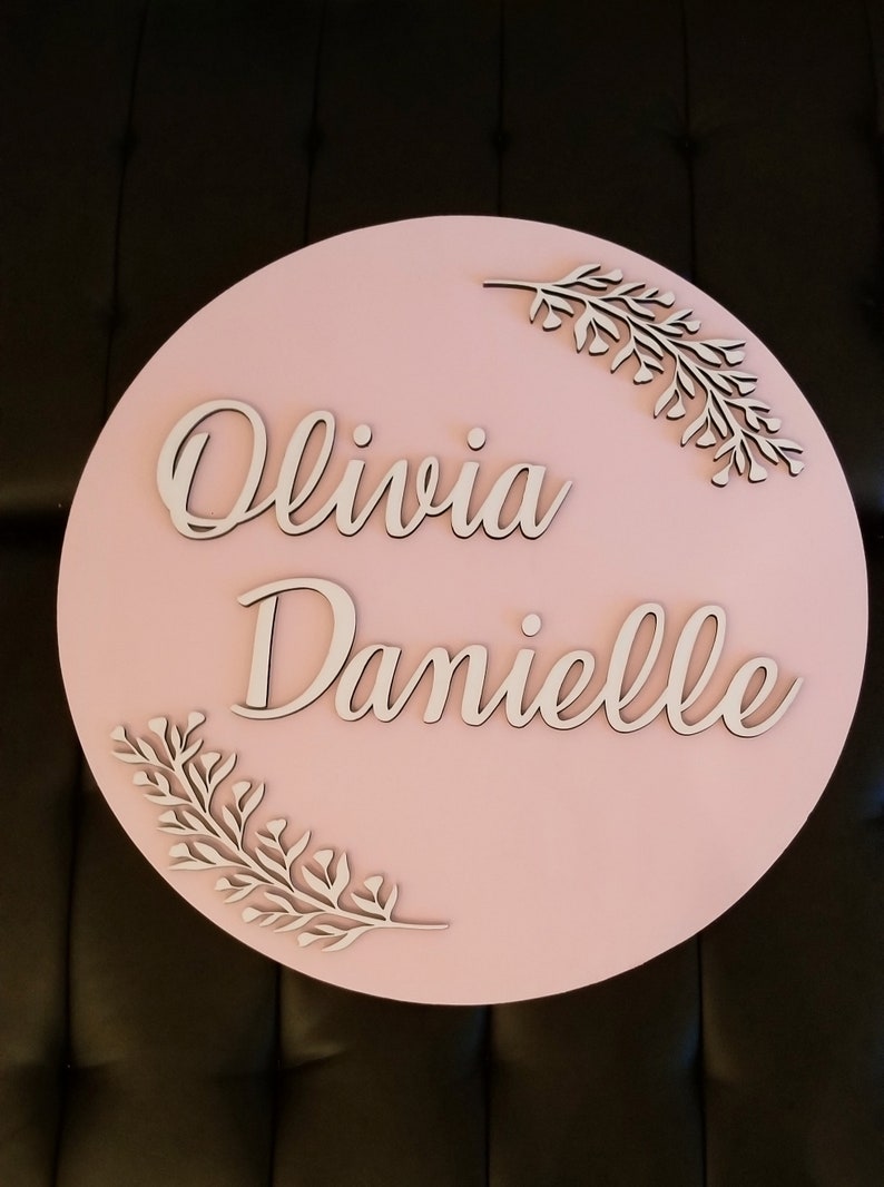 Large Wood round name sign with greenery 24